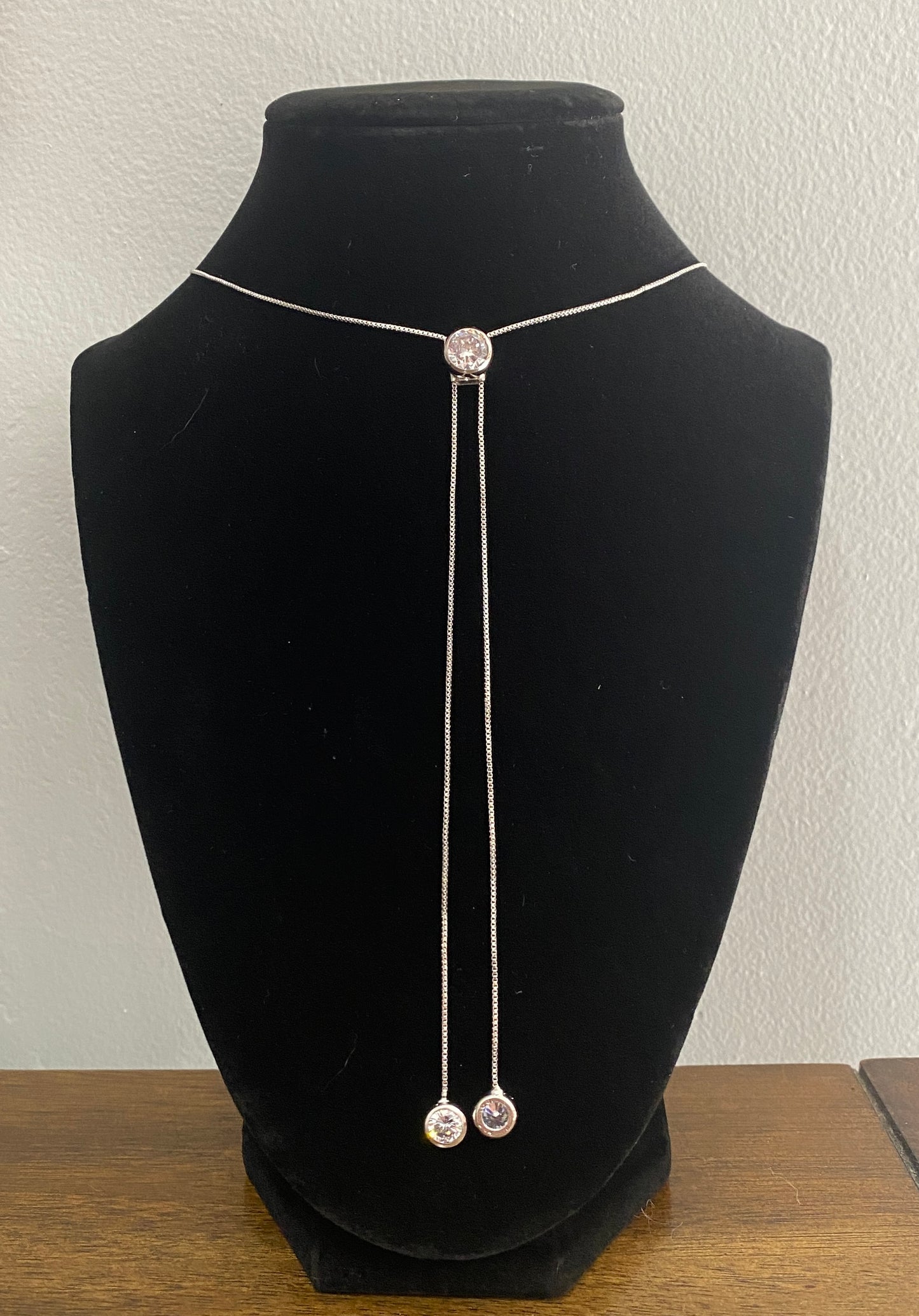 Adjustable 34" Rhodium Lariat Necklace with CZ Accents.