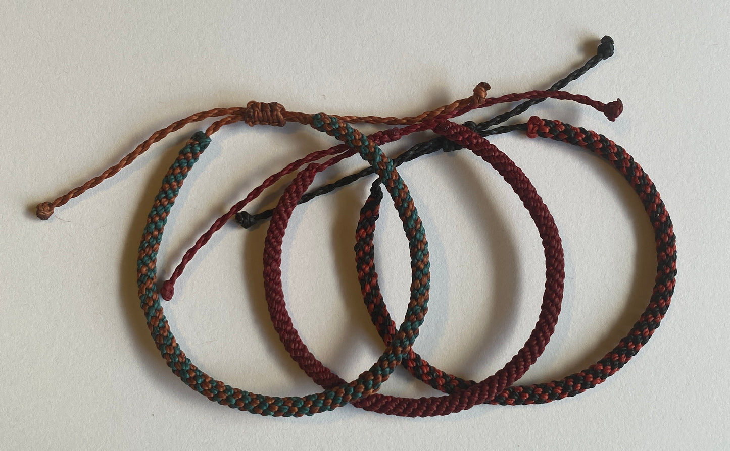 Hand braided nylon cord adjustable bracelet.