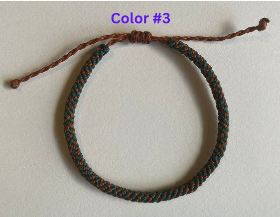 Hand braided nylon cord adjustable bracelet.
