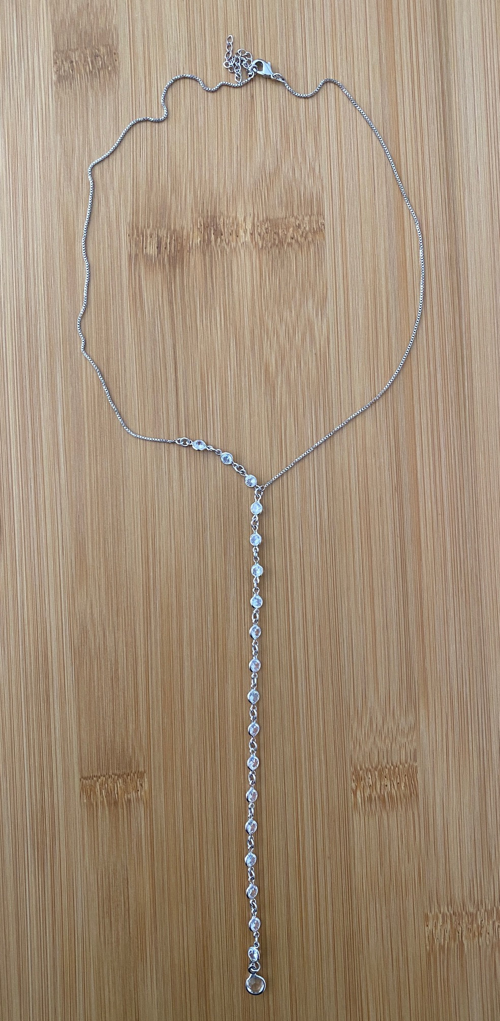 Rhodium CZ Beaded Lariat Necklace – Box Chain, 17" + 2" Extension. Delicate Lariat necklace with clear CZ accents.